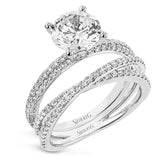 Sophisticated and glamorous, this white gold engagement ring's halo and sides feature .65 ctw of round white diamonds as well as .42 ctw of white diamond side stones.