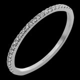 This diamond engagement ring has a sparkling line of prong set diamonds along the band, leading up to the center halo of round diamonds 0.39 ctw., and has 2 peek-a-boo yellow diamonds 0.02 ctw.