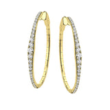 A fresh take on the diamond hoops in 18K yellow gold 1.11 ctw, they taper at the ends and feature larger diamonds in the center graduating to small towards the ends.