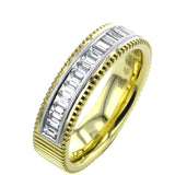 A striking 18K two toned ring with a ribbed yellow gold band and a row of baguette diamonds 0.59 ctw., in a delicate white gold beaded channel