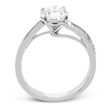 This engagement ring in 18 kt white gold has a gentle curved band of sparkling baguettes 0.39 ctw.