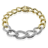 Links of 18K yellow gold and 2.71 ctw diamonds set in white gold, interlock in a shimmering ladies bracelet 7.5
