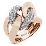 A modern take on the love knot this right hand ring in 18K yellow and white gold, features interlocking links of high polish gold and a diamond link 0.79 ctw.