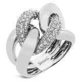 A modern take on the love knot this right hand ring in 18K yellow and white gold, features interlocking links of high polish gold and a diamond link 0.79 ctw.