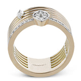 This rose/white 2tone cigar band has an open weave design and features a single MQ diamond .10 ctw., and a marquise shaped station with 0.27 ct. of RD diamonds.
