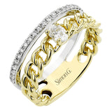 This modern right hand ring from our chain link collection, combines two looks & features a 0.21 ctw oval diamond set in yellow gold links, lined by a white gold band of RD diamonds 0.20 ctw.