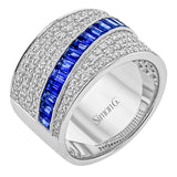 18K white gold wide right hand diamond ring 2.0 ctw., boasts multiple rows of RD diamonds 0.92 ctw, and a diagonal row of baguettes 1.08 ctw.