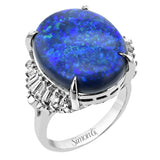 This platinum right hand fashion ring features a boulder Opal center 11.94 ctw., highlighted by baguette diamonds .30 ctw., and round diamonds 0.13 ctw.