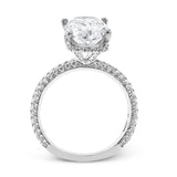 This stunning engagement ring  from our under halo collection is made for an oval center diamond, and set with 0.80 ctw of pave set diamonds in 18 kt white gold.