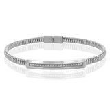 A perfect stacking bangle made of 18K white gold cable, adorned with a diamond plaque 0.23 ctw. and magnetic closure