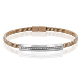 A perfect stacking bangle made of 18K rose gold cable, adorned with a diamond plaque 0.23 ctw. and magnetic closure