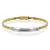 A perfect stacking bangle made of 18K yellow gold cable, adorned with a diamond plaque 0.23 ctw. and magnetic closure