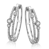 These whimsical 1.0 ctw diamond hoops have 2 rows of diamonds and are accented with larger bezel set diamonds for a modern twist