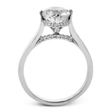This elegant white gold engagement ring takes a round center and is adorned with a delicate under halo, and a line of diamonds on the side profile 0.13 ctw