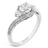 This beautiful ring features a three stone design with 2 side stones 0.33 ctw., set in a vintage-inspired shank. A diamond accented knife edge curved band .15ctw, and is perfect for those who want a classic look with a unique twist.