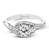 This beautiful ring features a three stone design with 2 side stones 0.33 ctw., set in a vintage-inspired shank. A diamond accented knife edge curved band .15ctw, and is perfect for those who want a classic look with a unique twist.