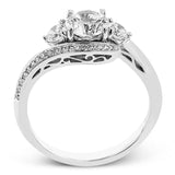 This beautiful ring features a three stone design with 2 side stones 0.33 ctw., set in a vintage-inspired shank. A diamond accented knife edge curved band .15ctw, and is perfect for those who want a classic look with a unique twist.