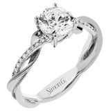 18K two-tone engagement ring has a delicate twist design with a polished yellow gold side trimmed with milgrain beading, and a diamond side 1/10 ctw. set in white gold