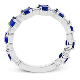 The perfect addition to any stack or bold enough to stand alone, this 18K white gold band showcases 1.69cttw oval sapphires and .35cttw diamonds.