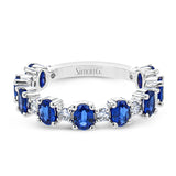The perfect addition to any stack or bold enough to stand alone, this 18K white gold band showcases 1.69cttw oval sapphires and .35cttw diamonds.