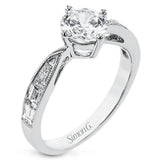 A fresh take on the engagement ring, this delicate ring has a high polished white gold shank with brilliant tapered baguettes .60 ctw, set in a soft milgrain beaded channel.