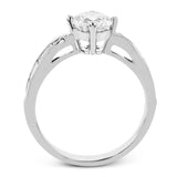 A fresh take on the engagement ring, this delicate ring has a high polished white gold shank with brilliant tapered baguettes .60 ctw, set in a soft milgrain beaded channel.