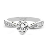 A fresh take on the engagement ring, this delicate ring has a high polished white gold shank with brilliant tapered baguettes .60 ctw, set in a soft milgrain beaded channel.
