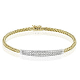 The perfect addition to any stack or worn alone, this 18K yellow gold bangle bracelet features 1.32cttw diamonds.