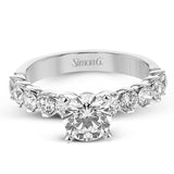 18K diamond engagement ring 0.90 ctw., features a half bezel setting on each individual side diamond which adds a modern bubble look to this ring