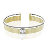 A modern statement that will stand the test of time, this 18k white and yellow gold bangle bracelet features 1.39cttw diamonds.
