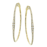 Oval statement hoops are the perfect compliment to day or night attire featuring 1.18cttw diamonds and set in 18K yellow gold.
