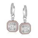 These 18K hexagonal shaped earrings stun with a mosaic diamond center 2.0 ctw., and a halo of pink diamonds .27 ctw set in rose gold, which dangle from diamond huggies .22 ctw.
