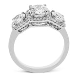 This 18K white gold past, present, future, ring elevates the look with halos of round diamonds around each stone 1.20 ctw.