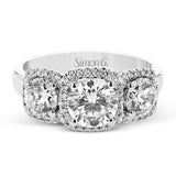 This 18K white gold past, present, future, ring elevates the look with halos of round diamonds around each stone 1.20 ctw.