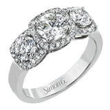 This 18K white gold past, present, future, ring elevates the look with halos of round diamonds around each stone 1.20 ctw.