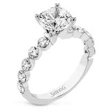 A modern design in 18K white gold with 0.90 ctw round diamonds, in a bubble setting that highlights each individual stone on the ring