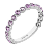 A modern design in 18K white gold with 0.90 ctw round diamonds, in a bubble setting that highlights each individual stone on the ring