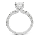 A modern design in 18K white gold with 0.90 ctw round diamonds, in a bubble setting that highlights each individual stone on the ring