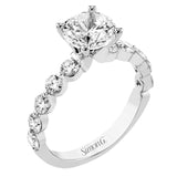 A modern design in 18K white gold with 0.90 ctw round diamonds, in a bubble setting that highlights each individual stone on the ring