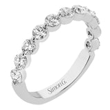 A modern design with a bubble setting that highlights each individual stone in this diamond wedding band 1.0 ctw.