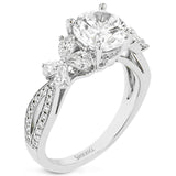A beautiful engagement ring perfect for those who love floral inspired designs. It features a split shank setting with diamond accents .20ctw., & 8 pear shaped diamonds .62ctw. that create the look of petals around the center stone.