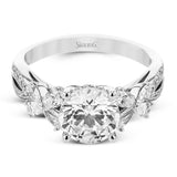 A beautiful engagement ring perfect for those who love floral inspired designs. It features a split shank setting with diamond accents .20ctw., & 8 pear shaped diamonds .62ctw. that create the look of petals around the center stone.