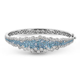 Make a statement with this geometric bangle bracelet featuring 1.91cttw rare pariba tourmaline and 4.21cttw diamonds.