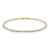 Dress up any outfit with this yellow gold diamond bangle gleaming with 1.5 ctw of round brilliant diamonds.