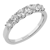 The perfect compliment to your ring, this simple & elegant 18 kt white gold diamond band has 1.10 ctw of round brilliant white diamonds
