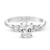 This modern 3 stone engagement ring is made for an oval center and flanked by 2 kite set diamonds 0.23 ctw, with round prong set diamonds along the shank 0.22 ctw.