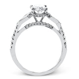 This modern 3 stone engagement ring is made for an oval center and flanked by 2 kite set diamonds 0.23 ctw, with round prong set diamonds along the shank 0.22 ctw.