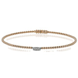 Simple and sweet, this 18k white and rose gold bangle is perfect worn alone or stacked and features .04cttw diamonds.