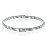 18k White gold textured bangle is highlighted by .25 ctw of diamonds set in a rectangular design. Perfect for stacking