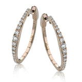 Dress up your classic button down with these 18K white gold hoops featuring .97cttw diamonds.